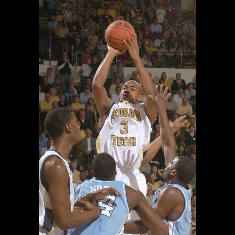 Georgia Tech's #3 Jarrett Jack shoots over UNC's #34 David Noel during first half play at the Alexander Memorial Coliseum in Atlanta, Georgia, February 10, 2004. Georgia Tech won 88-77.