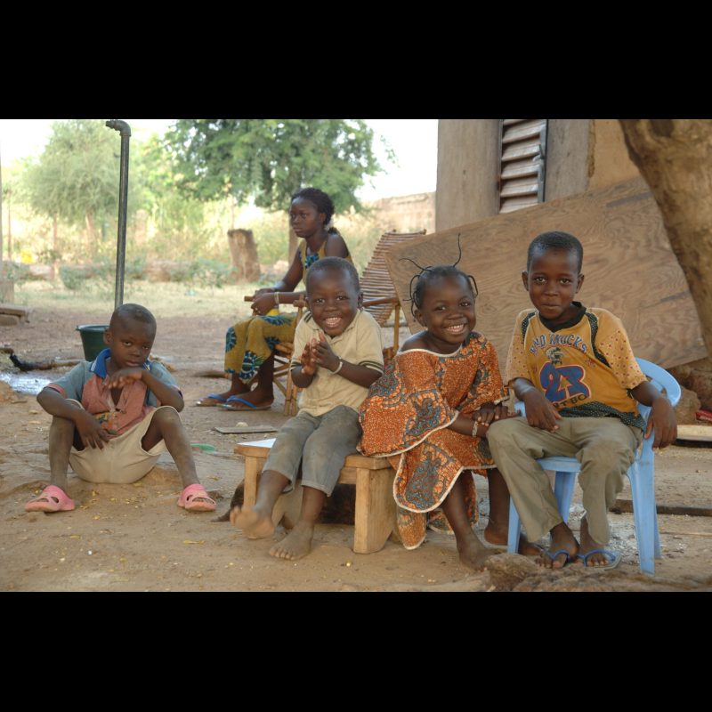 KOUDOUGOU, Burkina Faso Children, including the sons and daughters of theology school director Antoine Zuma, sit and play together outside in Koudougou, Burkina Faso. Family and community life are closely connected in this vibrant West African town.