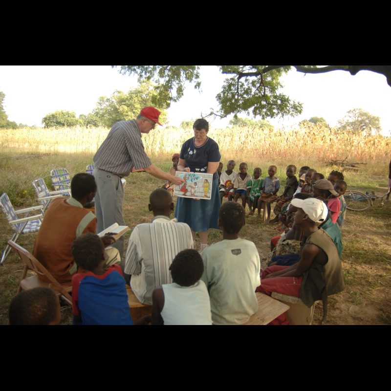 VILI VILLAGE, Burkina Faso Clarence and Lynn Lance began a "Storying Point" in Vili Village, just outside of Koudougou, Burkina Faso, where Pastor Emanuel Yameogo (wearing the brown shirt) leads the group. The gathering, primarily of children, focuses on sharing Bible stories and building community.