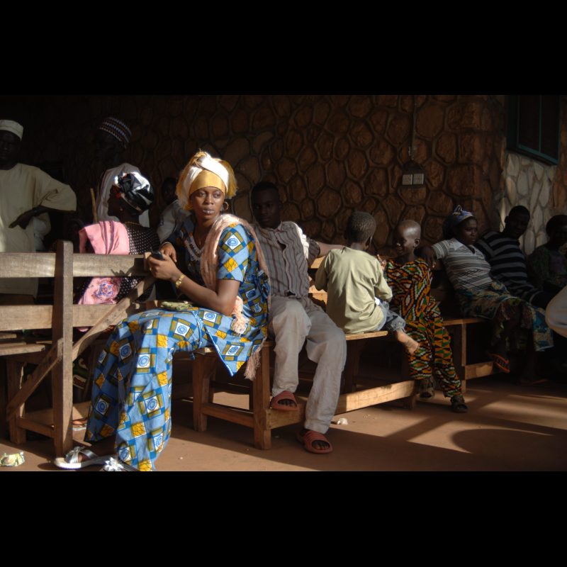 NALERIGU, Ghana A woman with a dazed expression sits amid a crowd waiting for medical treatment at the Baptist Medical Centre in Nalerigu, Ghana. The hospital is often overwhelmed with patients seeking care from across the region.