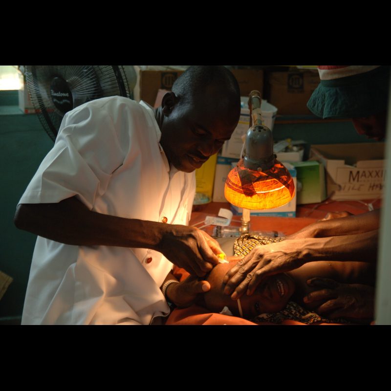 NALERIGU, Ghana A nurse inserts an IV into the head of a child in the pediatric ward at the Baptist Medical Centre in Nalerigu, Ghana. Due to limited resources, medical staff often use alternative methods to provide essential care for young patients.