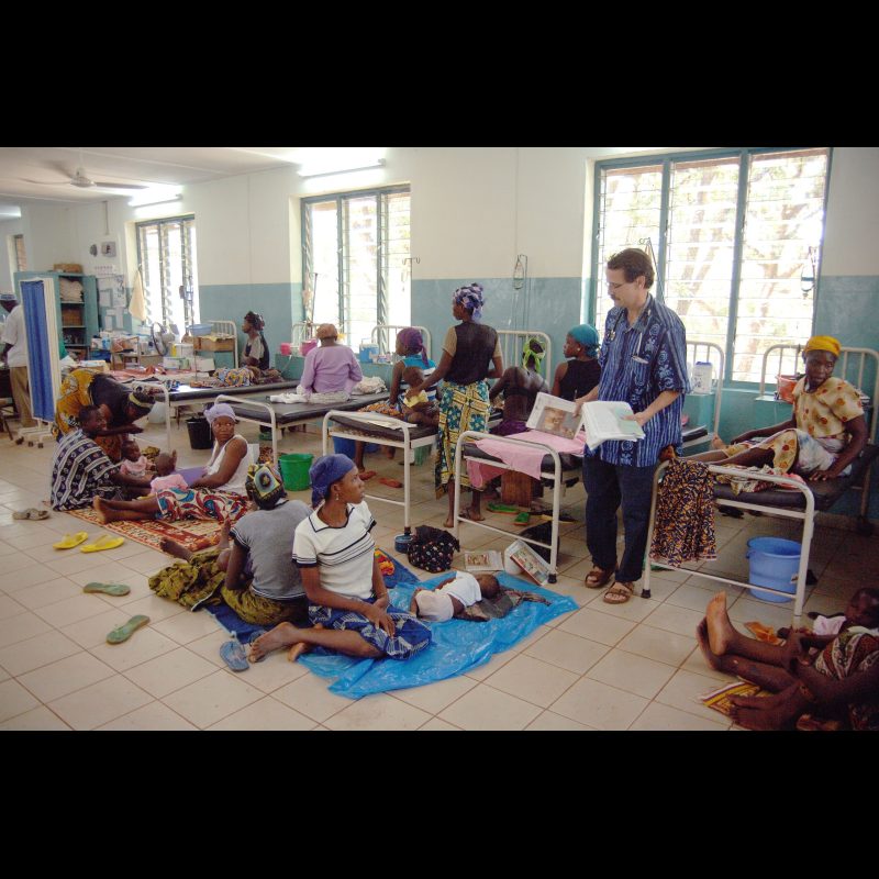 NALERIGU, Ghana — Dr. George Faile, a family practitioner, rounds through the children’s ward at the Baptist Medical Centre in Nalerigu, Ghana. Unlike hospitals with large nursing staffs, parents here play a vital role in helping care for their children during treatment.