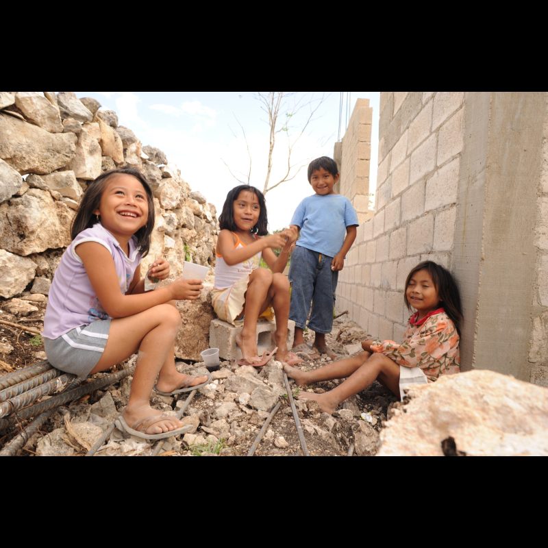 BECANCHÉN, Mexico Young children play near a church under construction in Becanchén, Yucatán, Mexico. Community life often centers around the church as a place of worship and gathering.
