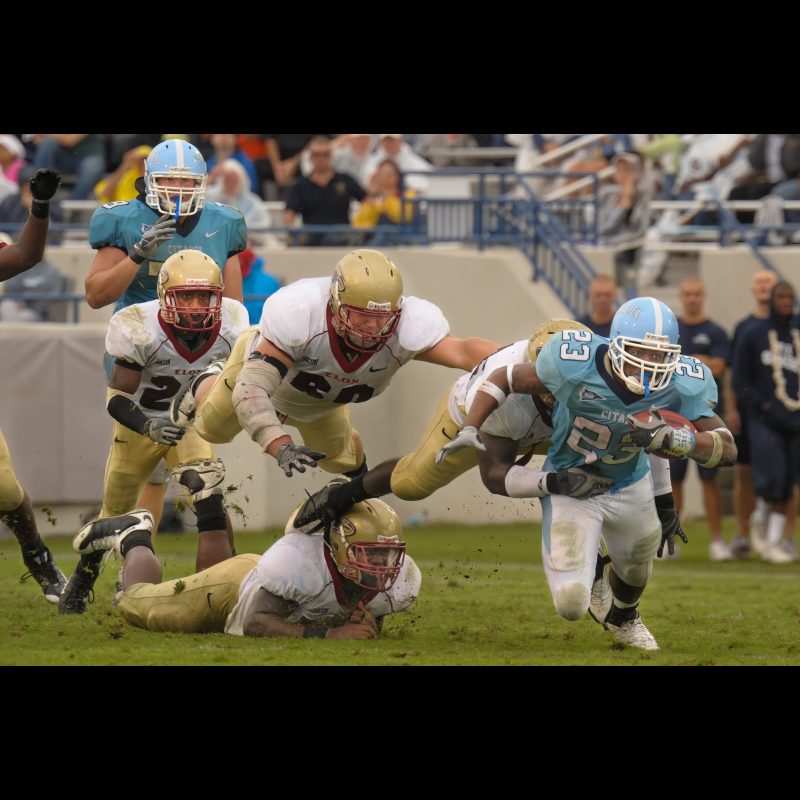 Oct 11, 2008; Charleston, SC, USA; Citadel Bulldogs running back Terrell Dallas (23) gains three yards before being tackled by Elon Phoenix defensive end Jordan Daniel (46) in the second half at Johnson Hagood Stadiumfinal Citadel Bulldogs 23 and Elon Phoenix 27.