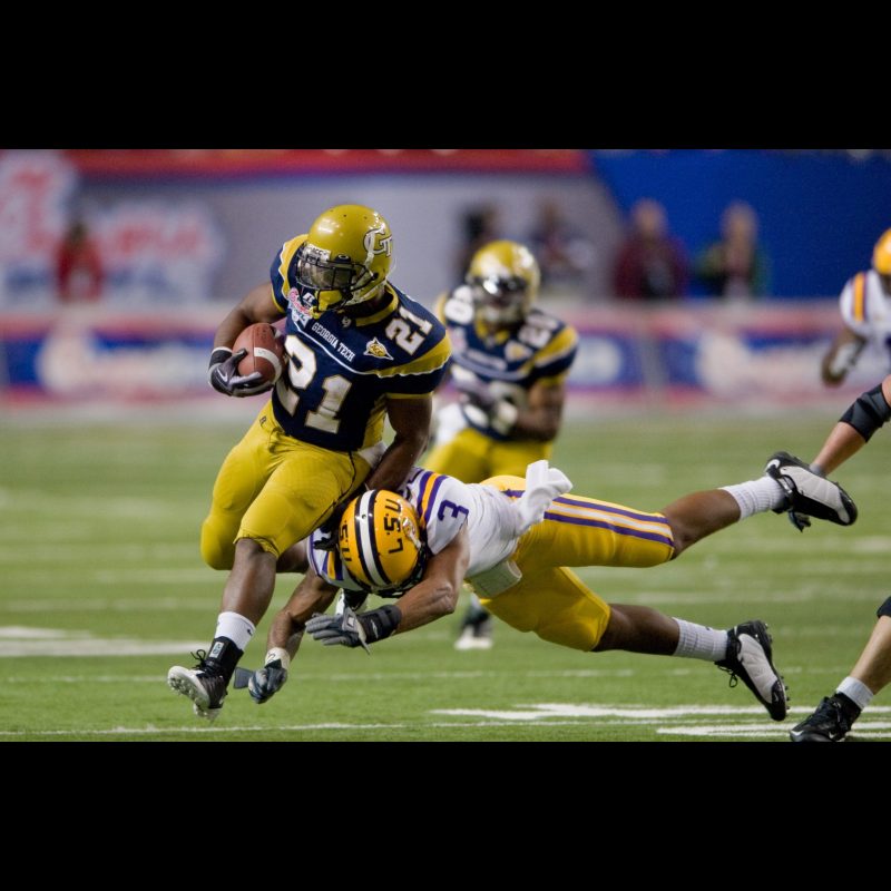 ATLANTA Georgia Techs Jonathan Dwyer (No.?21) evades a tackle attempt by LSUs safety Chad Jones (No.?3) during the 2008 Chick-fil-A Bowl on December 31 at the Georgia Dome. Despite moments of offensive effort, Tech struggled to gain momentum against LSUs defense in the 383 loss.
