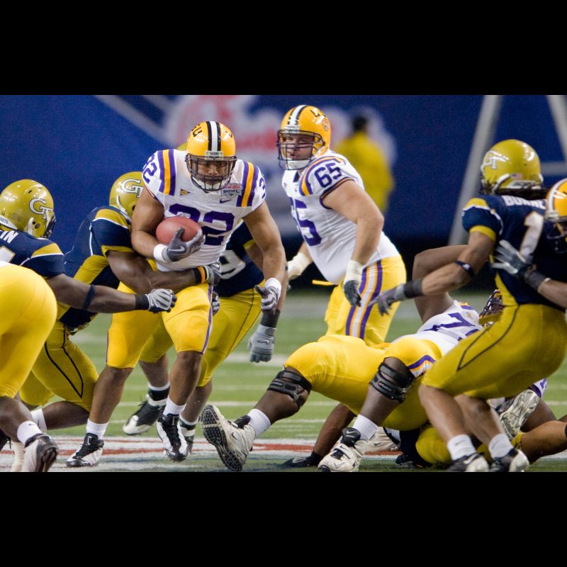 ATLANTA LSU running back Charles Scott (#32) powers through Georgia Techs defense during the 2008 Chick-fil-A Bowl on December 31 at the Georgia Dome. LSU dominated the game with a strong running attack, securing a 383 victory over the Yellow Jackets.