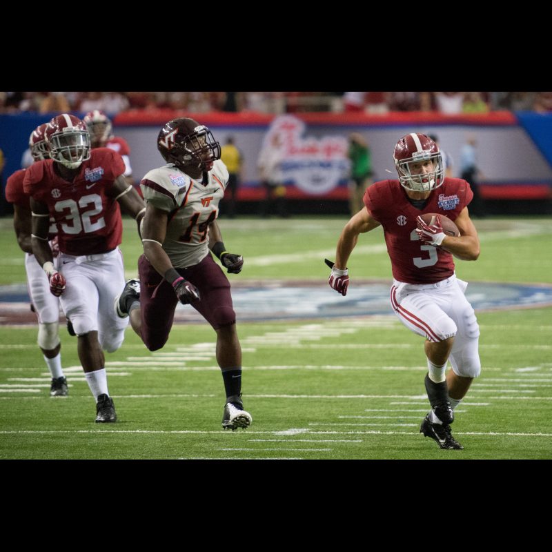 Alabama Crimson Tide defensive back Vinnie Sunseri (3) scores a touchdown against Virginia Tech Hokies running back Trey Edmunds (14) during the 2013 Chick-fil-A Kickoff game at the Georgia Dome.