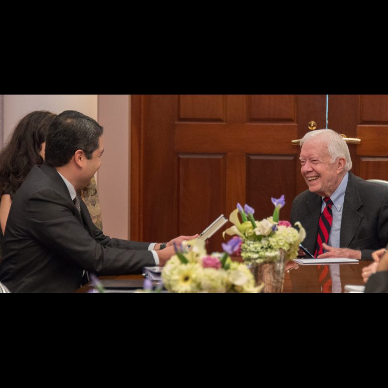 President of Honduras Juan Orlando Hernández meets with former U.S. President Jimmy Carter at the Carter Center in Atlanta, Georgia, on Nov. 13, 2014.