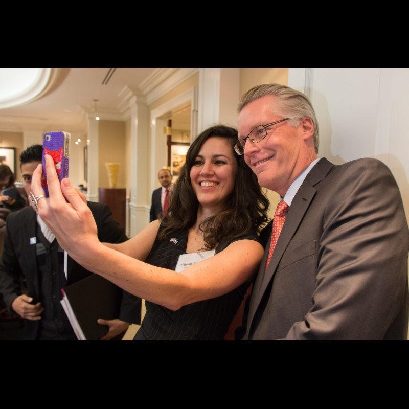 Ed Bastian, the CEO of Delta, takes selfies with the media contact of the president of Honduras' team on his visit to Atlanta.