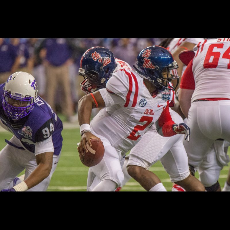 Ole Miss QB (2) DeVante Kincade looks for open receiver in game against TCU during the Chick-fil-A Peach Bowl in Atlanta, GA.