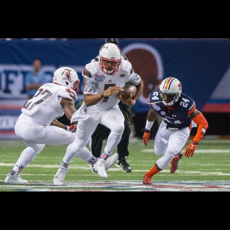Reggie Bonnafon (7) eludes a tackle during the season opening game between Auburn University. Final Score Auburn 31 Louisville 24