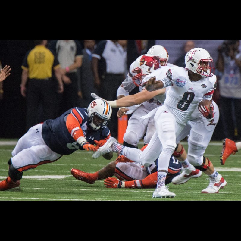 Lamar Jackson #8 of the Louisville Cardinals rushes against the Auburn Tigers at Georgia Dome on September 5, 2015. Final Score Auburn 31 Louisville 24