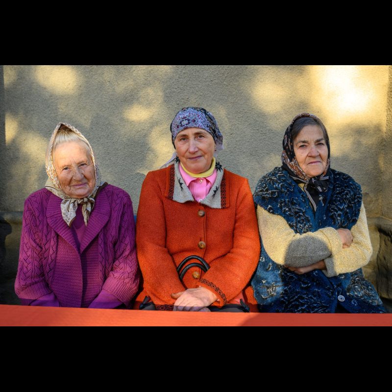 OBREJA VECHE, Moldova — Three elderly women wait in line to see the medical team during a free clinic at Golgotha Church in Obreja Veche, Fălești District, Moldova. The medical outreach, organized by ABWE missionaries, provides essential healthcare services to residents in the rural community.