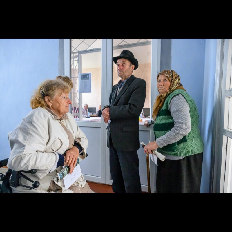 MĂRĂNDENI, Moldova — A group of elderly residents wait to see a doctor during a free medical clinic held at the Casa de Cultură in Mărăndeni, Fălești District, Moldova. The clinic, organized by ABWE missionaries, offers healthcare services and support to underserved members of the community.