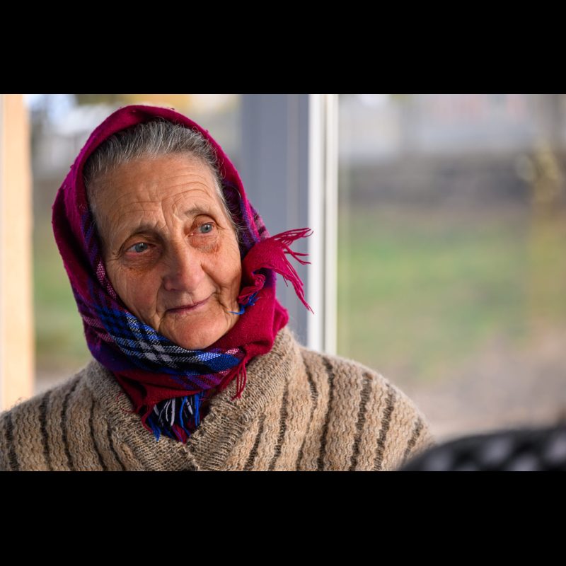 HILIUȚI, Moldova — A woman waits to be seen at a medical clinic set up on a soccer field along Strada Independenței in the village of Hiliuți, Fălești District, Moldova. The clinic is part of an outreach sponsored by ABWE missionaries, providing free care and support to residents in need.