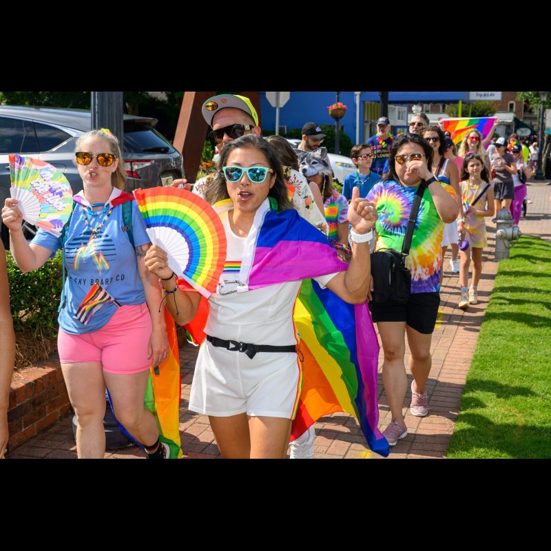 Participants wear their Pride colors as they walk down Canton Street during Roswell’s first-ever Pride Parade on June 21, 2025, celebrating LGBTQ+ visibility and community.
