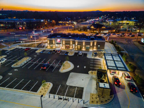 Chick-fil-A Roswell Town Center at dusk. In the distance is Kennesaw Mountain.